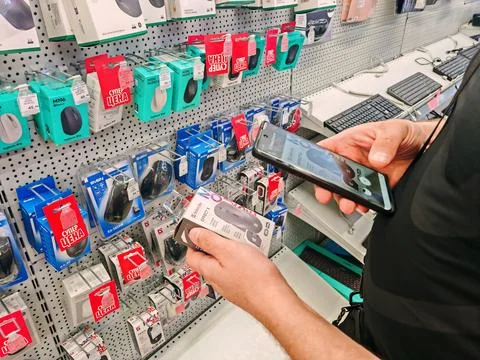 Hand Choosing Computer Mouse in Store Stock Photos