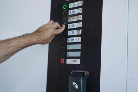 Hand choosing a program on a self-service car wash control panel, selecting.. Stock Photos