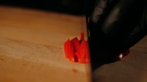 Hand chopping pepper with a knife Stock Footage 125458443