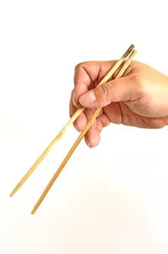 Hand with chopsticks Stock Photos
