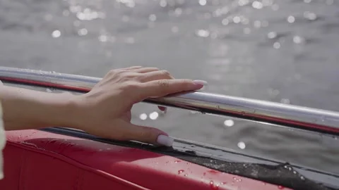 Hand on the chrome railing of a motorboat Video stock 329248596