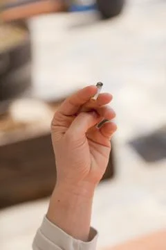 Hand with cigarette Stock Photos