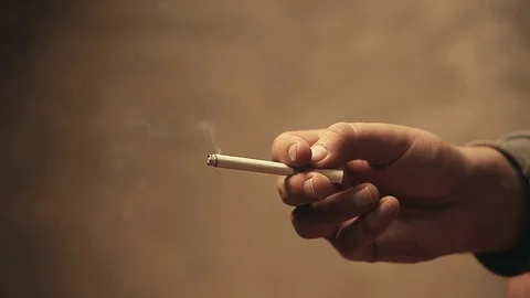 Hand cigarette smoke sharp wall Stock Footage 117179136