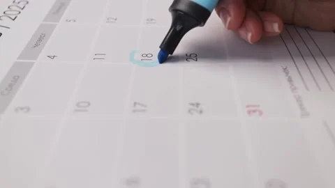 Hand circles a calendar date with marker, planning follow-up appointment an.. Video stock 331442310