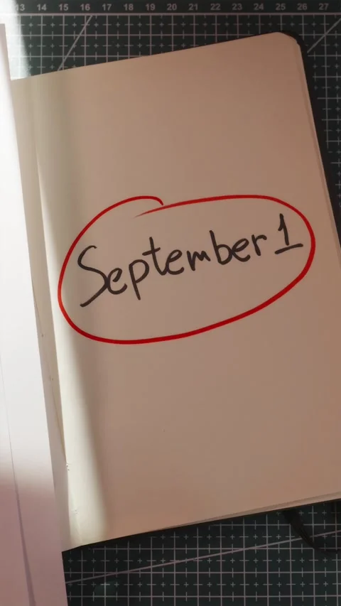 Hand circling 1 September date with red marker vertical Stock Footage 340139059