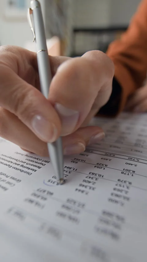 Hand Circling Information on Paper Document Stock Footage 327346441