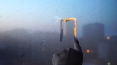 Hand circling the light in the window repeating the contour of the building Stock Footage 125111353