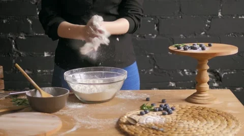 Hand Clap of Chef with Splash Flour on Wood Background Video stock 61379582