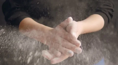 Hand Clap of Chef with Splash Flour on Wood Background Video stock 61379656