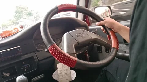 Hand on a Classic Steering Wheel Stock Footage 242890746