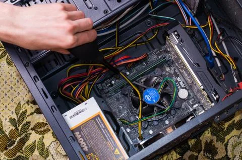 Hand clean black computer pc with air pear Stock Photos