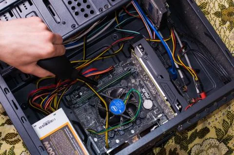 Hand clean black computer pc with air pear Stock Photos