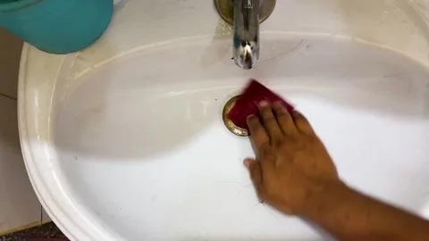 Hand Cleaning Bathroom Sink Drain with Scrubbing Pad for Household Hygiene Stock Footage 336981630