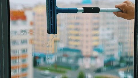 Hand with a cleaning brush is washing wi... | Stock Video | Pond5