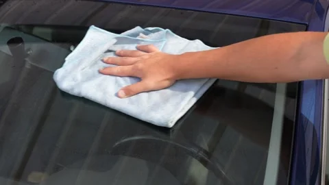 Hand Cleaning Car Windshield With Microfiber Cloth Close Up Stock Footage 343156994