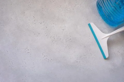 Hand cleaning a car windshield with window cleaner wiper. Stock Photos