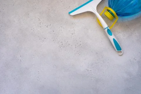 Hand cleaning a car windshield with window cleaner wiper. Stock Photos