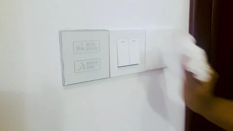 A Hand Cleaning Electric Switch Button On Wall. Stock Footage 167121751