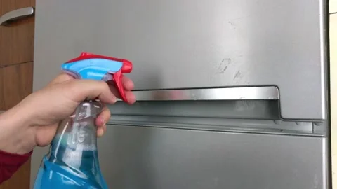 Hand cleaning fridge door Stock Footage 132317422