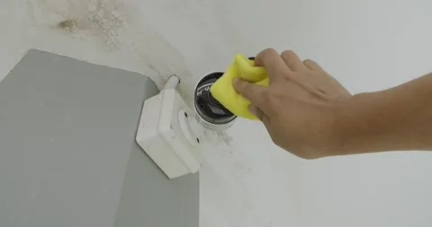 Hand cleaning home security camera. Stock Footage 245606064