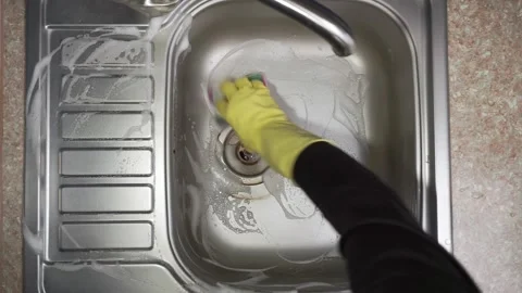 Hand cleaning kitchen sink Stock Footage 310539571