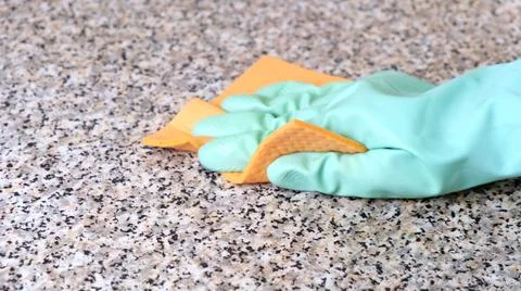 Hand Cleaning Kitchen Work Surface with Rubber Gloves and Disinfectant Spray Stock Photos