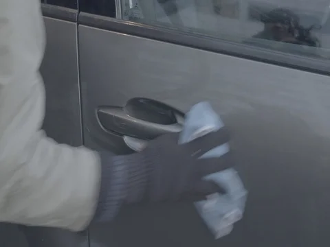 Hand cleaning polishing beautiful luxury sport SUV car close up Stock Footage 75760053