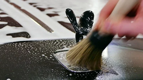 Hand cleaning of Rolls-Royce logo emblem Spirit of Ecstasy Stock Footage 94528318
