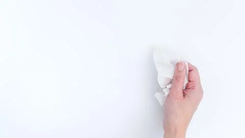 Hand Cleaning a Surface with a Wipe for Hygiene and Health, Isolated on White Stock Photos