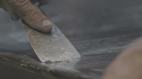 A Hand cleaning with a wood chisel Stock Footage 145617523