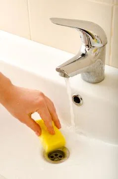 Hand cleans tap Stock-Fotos
