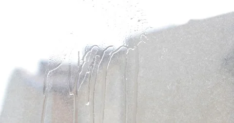 Hand cleans the wiper with a dirty window from the outside Stock Footage 139094176