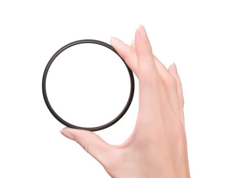 Hand with clear camera filter isolated with path Foto stock