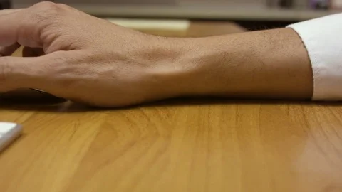Hand clicking and scrolling away on a mouse. Stock Footage 79237750