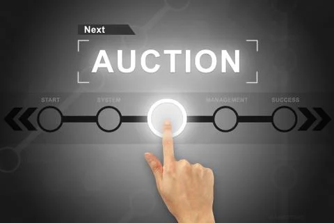 Hand clicking auction button on a screen interface Stock Photos