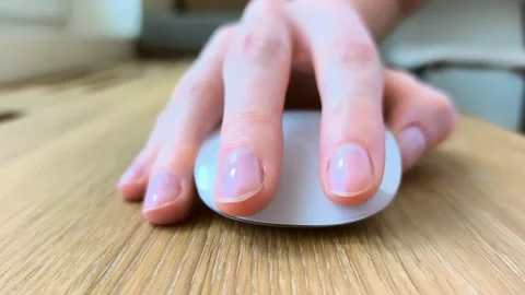 Hand clicking a computer mouse during everyday work. Fingers pressing the b.. Stock Footage 340283742