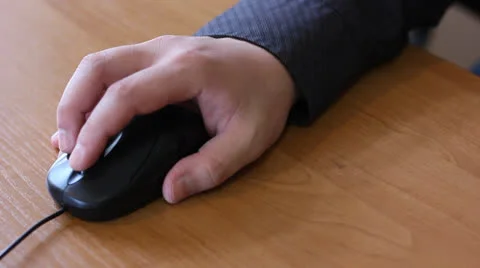 Hand clicking computer mouse Stock Footage 22478811