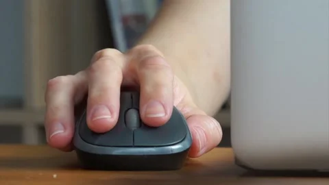 Hand clicking computer mouse. Online working from home, office, internet surfing Stock Footage 234215978
