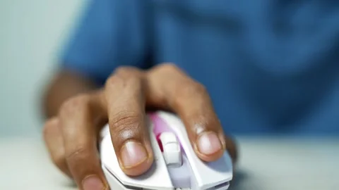 Hand Clicking White Computer Mouse, Close-up of a person's hand using a whi.. Stock Footage 345119713