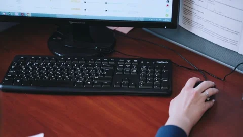 The hand clicks the computer mouse, and then types on the keyboard Stock Footage 173157521
