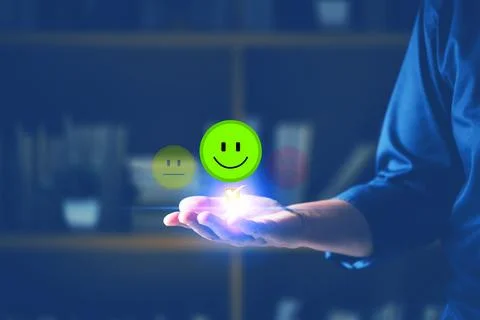Hand of client show a feedback with smiley face. Service rating, satisfacti.. Stock Photos