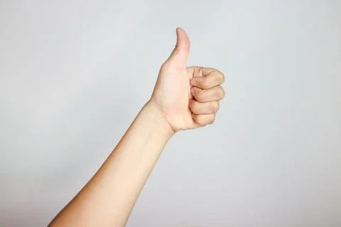 Hand of client show thumb up isolated on white background. Service rating, .. Stock Photos