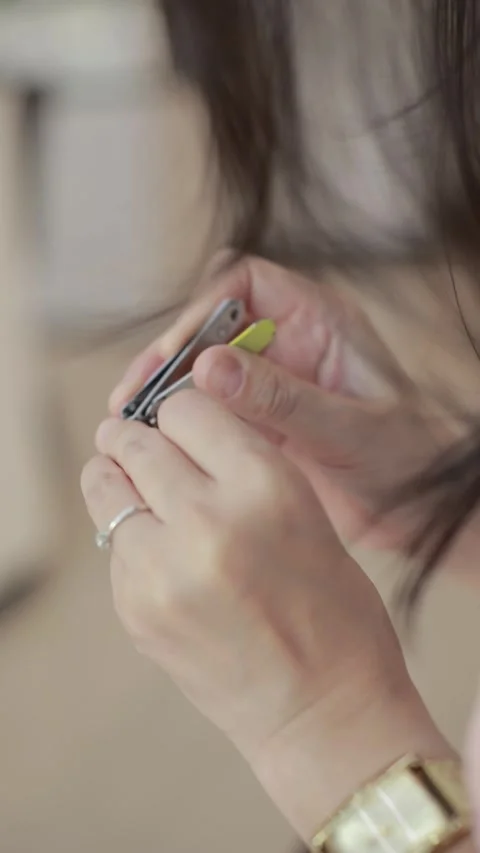 Hand clipping fingernails, closeup of hands Video stock 290059483