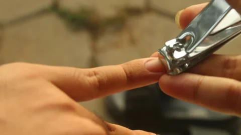 Hand Clipping Fingernails with Nail Clipper Stock Footage 346393328