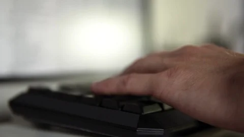 Hand close-up behind the computer keyboard Stock Footage 122264584