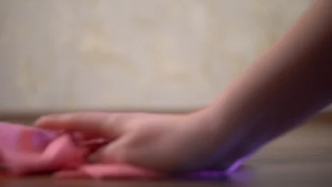 Hand close up cleaning floor with pink microfiber rag at home Stock Footage 129821580