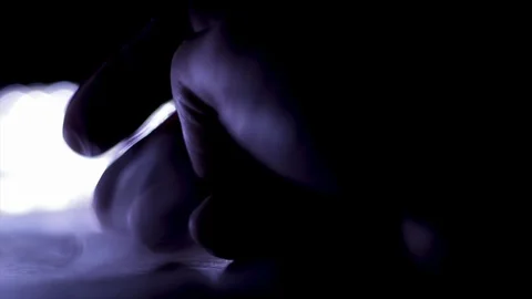 Hand close up dramatic lighting darkness smoke and dim lite environment. Close u Video stock 125095969