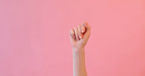 Hand close- up , finger pointing at a person, on a pink background Stock Footage 126043624