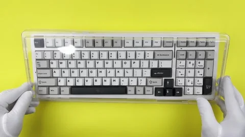 A hand close a keyboard with a cover Stock Footage 322518065