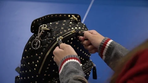 Hand close lock on a suitcase close up in slow motion Stock Footage 122096919